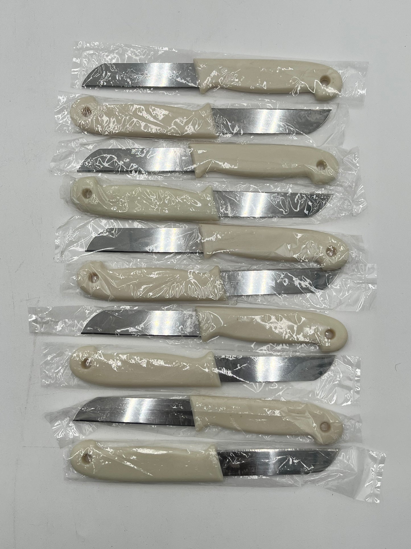 Craft & Floral Knives with beige handle, sold individually for $ .99, in packs of 10 or boxes by floralsuppliespoint1.com.