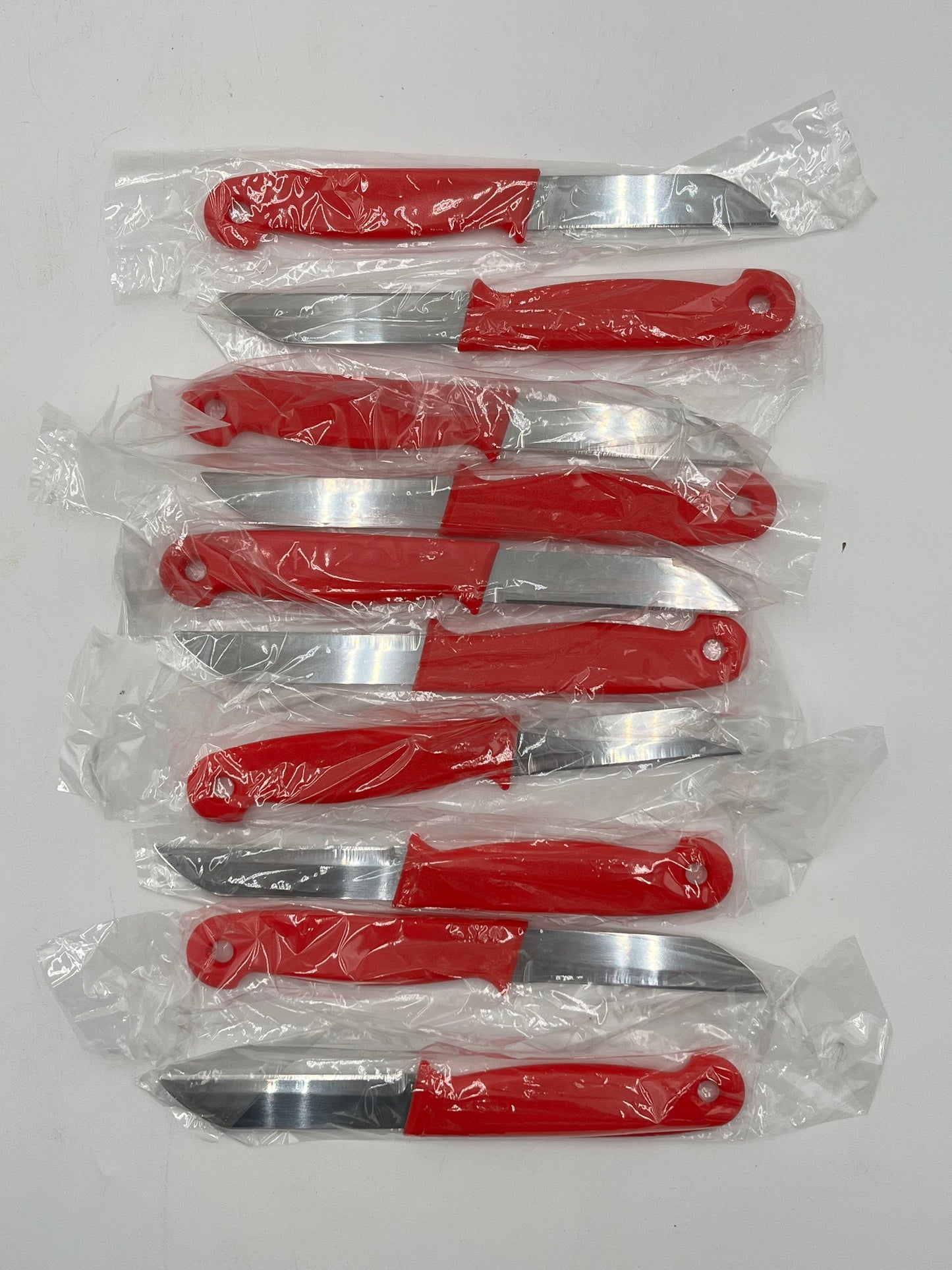 Craft & Floral Knives with red handle, sold individually for $ .99, in packs of 10 or boxes by floralsuppliespoint1.com.