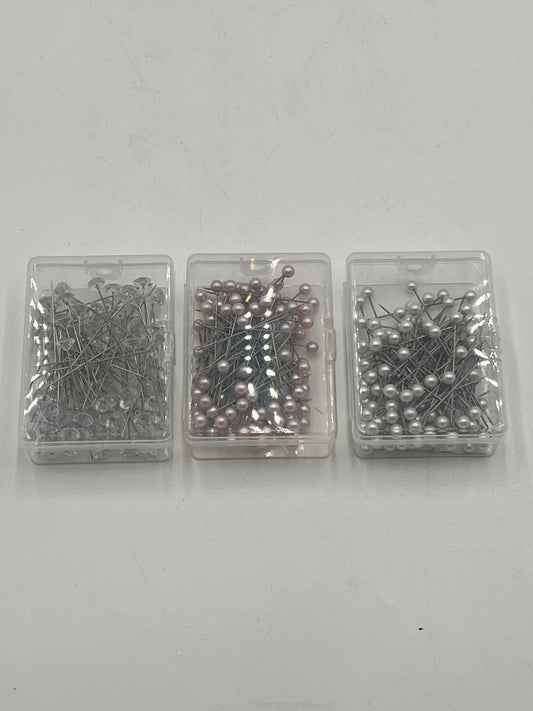 Decorative floral pins in pearl white, pink & diamond crystal styles, 50 pcs per box. Sold retail or wholesale 10-packs by floralsuppliespoint1.com.