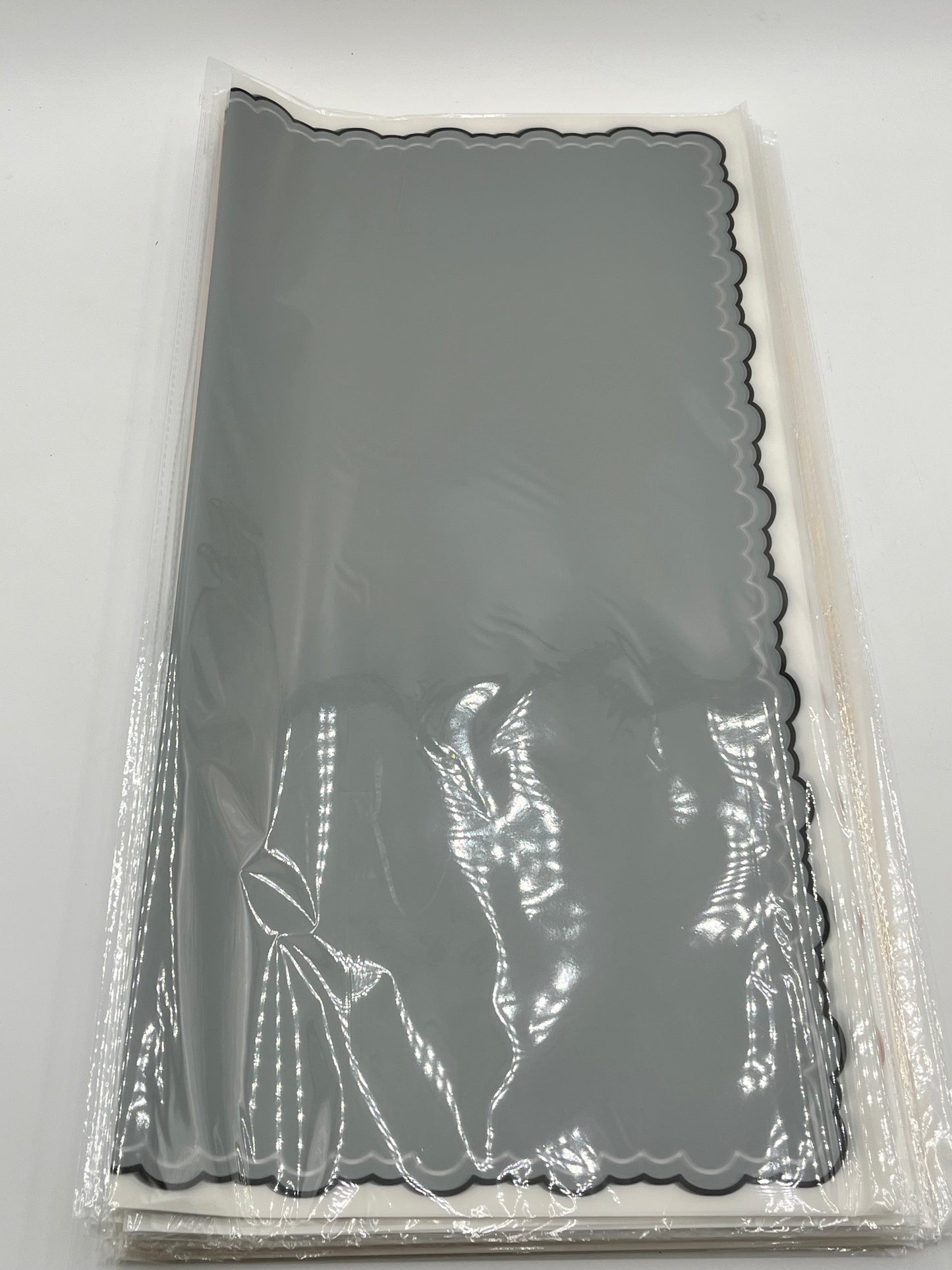 Gray  elegant scalloped wrapping paper, 22 in x 22 in, packs of 20 for $9.99. Perfect for flowers, gifts & crafts, sold by floralsuppliespoint1.com