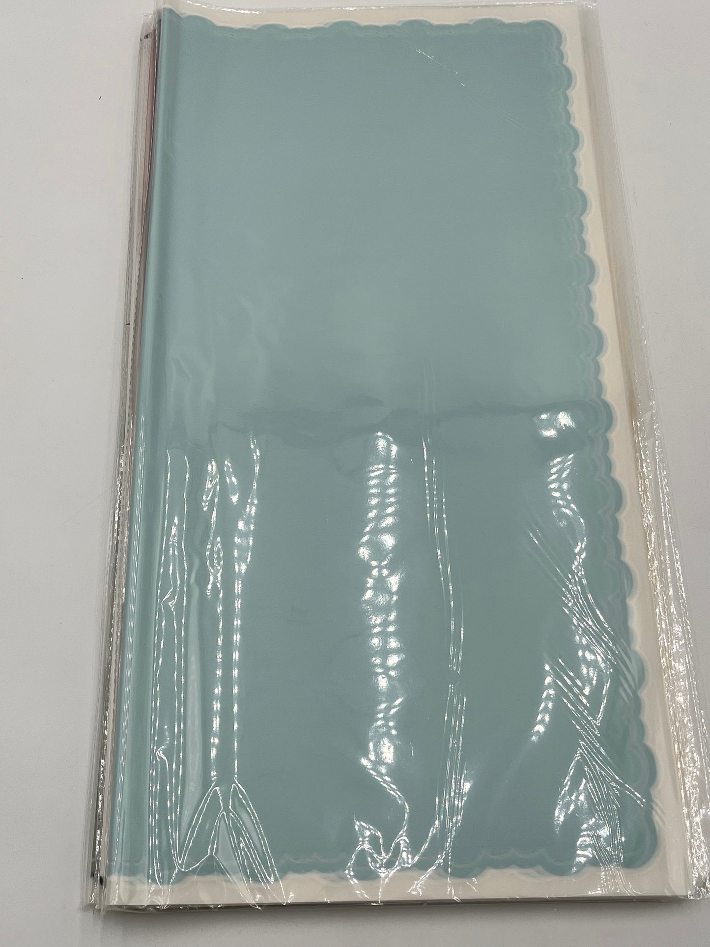 light blue elegant scalloped wrapping paper, 22 in x 22 in, packs of 20 for $9.99. Perfect for flowers, gifts & crafts, sold by floralsuppliespoint1.com