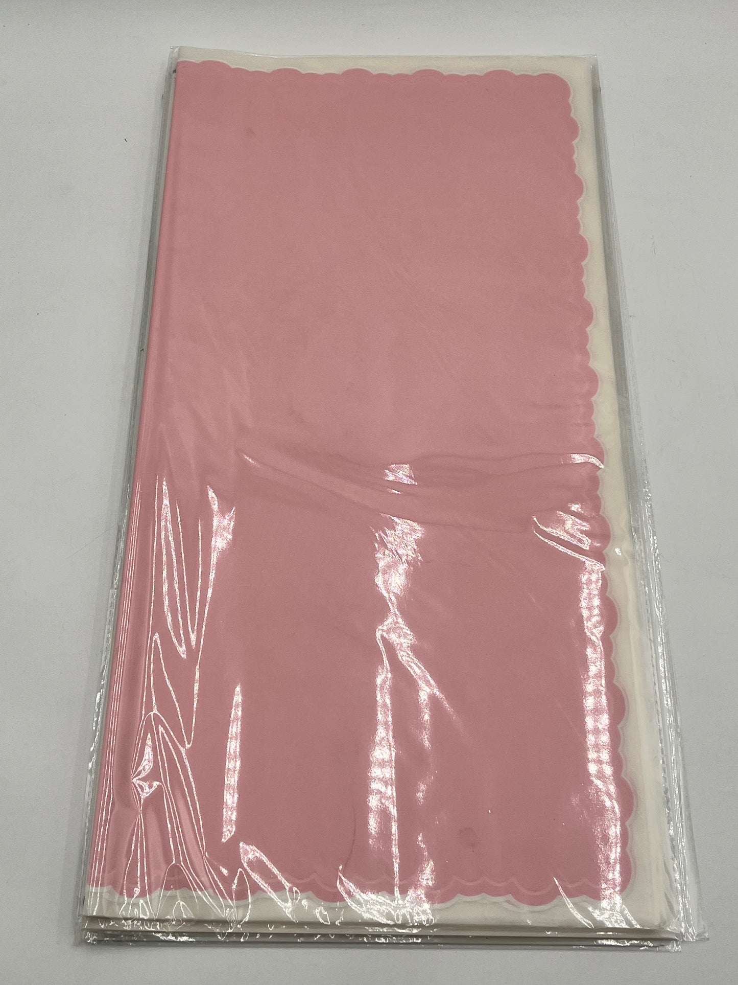 Pink elegant scalloped wrapping paper, 22 in x 22 in, packs of 20 for $9.99. Perfect for flowers, gifts & crafts, sold by floralsuppliespoint1.com