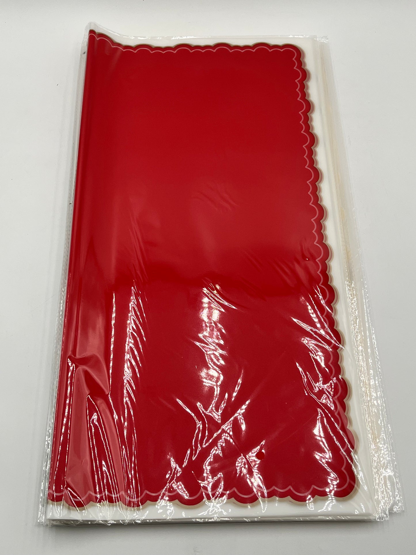 Red elegant scalloped wrapping paper, 22 in x 22 in, packs of 20 for $9.99. Perfect for flowers, gifts & crafts, sold by floralsuppliespoint1.com