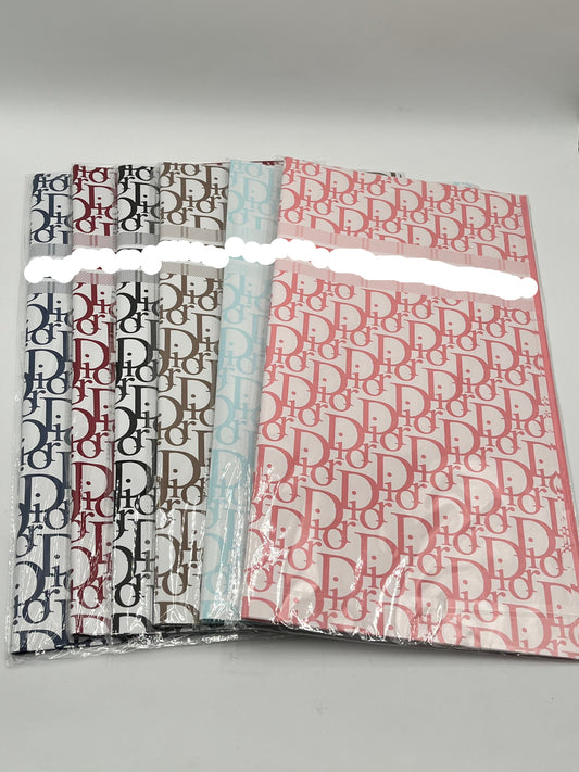 22x22 inch floral wrapping paper with iconic CD monogram in Dark Blue, Red Wine, Black, Brown, Light Blue & Pink.Sold by floralsuppliespoint1.com for $9.99