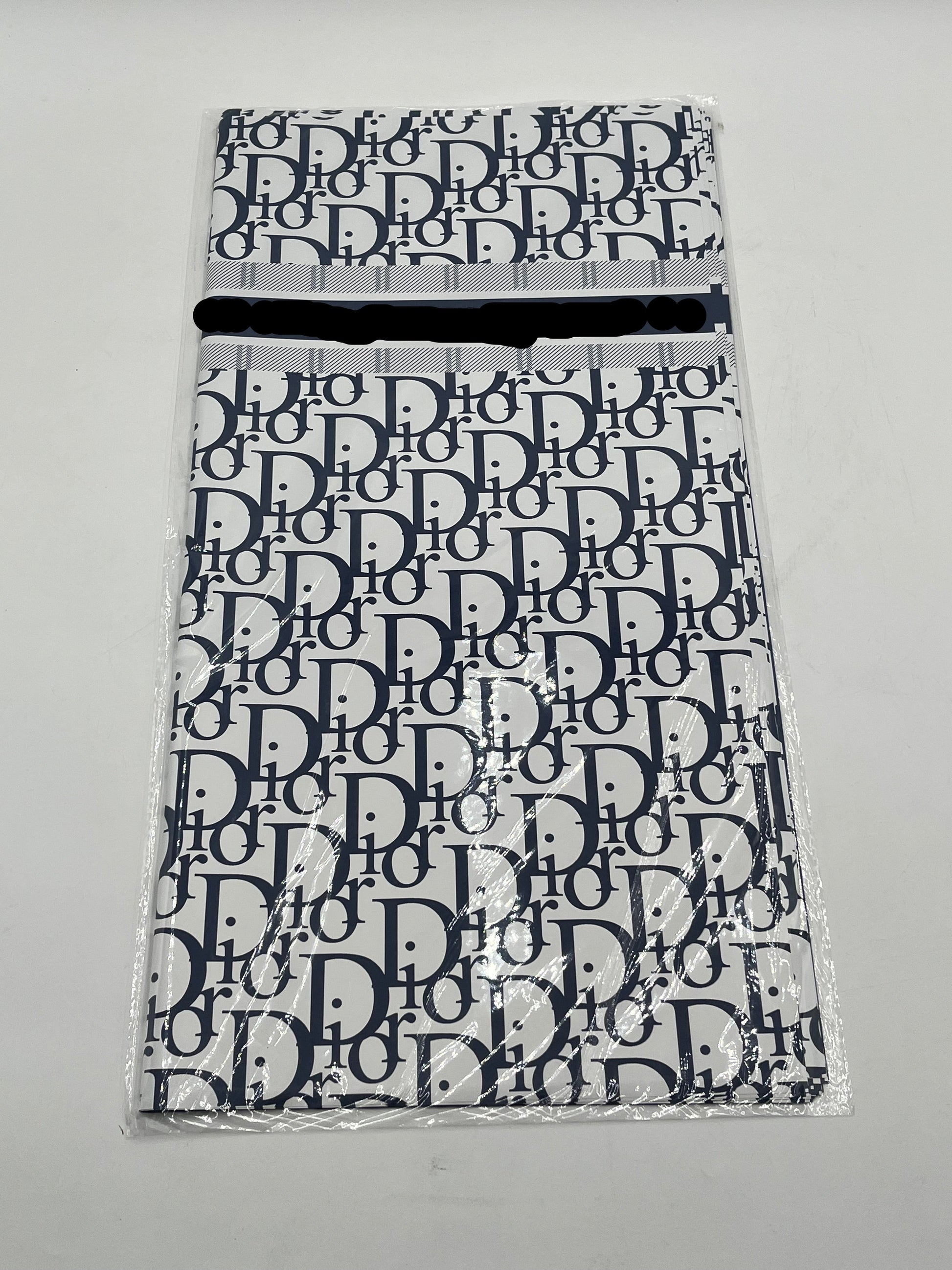 22x22 inch floral wrapping paper with iconic CD monogram in Dark Blue.Sold by floralsuppliespoint1.com for $9.99