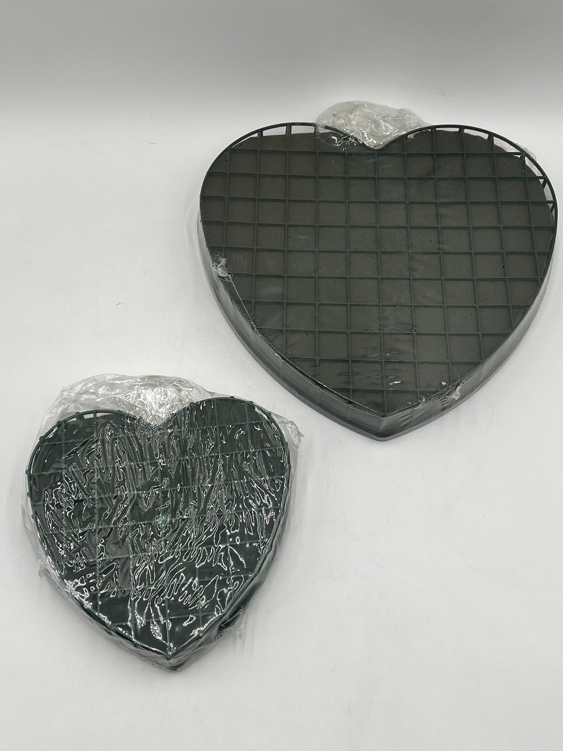 Heart-shaped floral foam wreath bases, 8" & 12", keep flowers fresh with water-absorbing foam & sturdy backing. Sold by floralsuppliespoint1.com.
