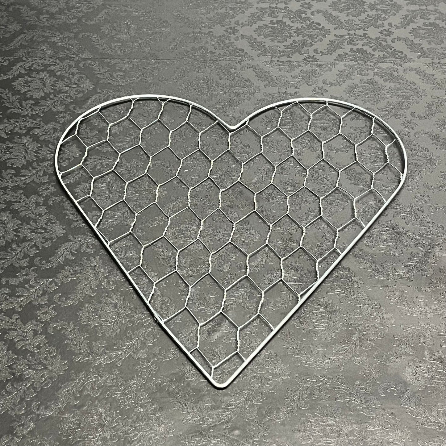 A heart of Haven wire mesh frame in medium size for floral design, sold for $11.99 by floralsuppliespoint1.com
