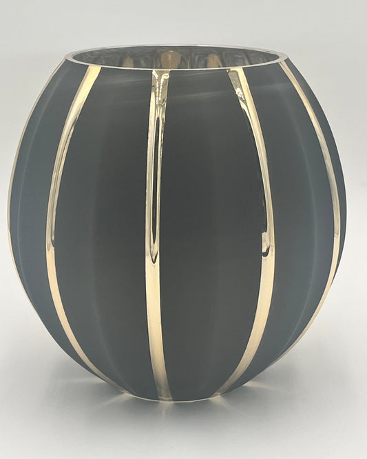 The Noctara Globe 8x4.75 Op by Floral supplies Point is a round vase in matte black with glossy vertical gold stripes, creating a striking sculptural look against its smooth surface and a plain white background.
