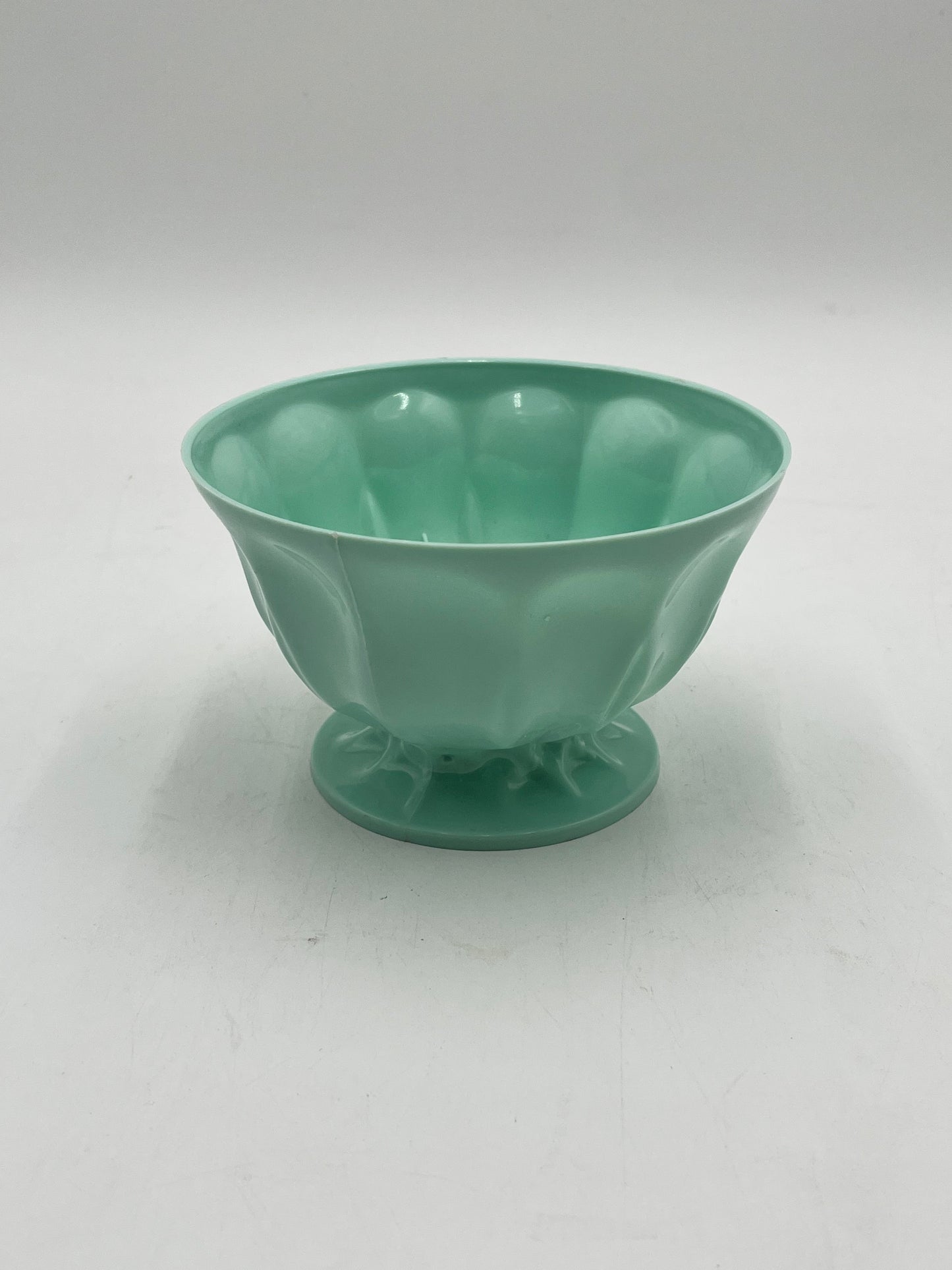 A pastel pedestal bowl in green.  Perfect 4x6 floral base for décor or sympathy tributes. Available @ floralsuppliespoint1.com for $5.99 each