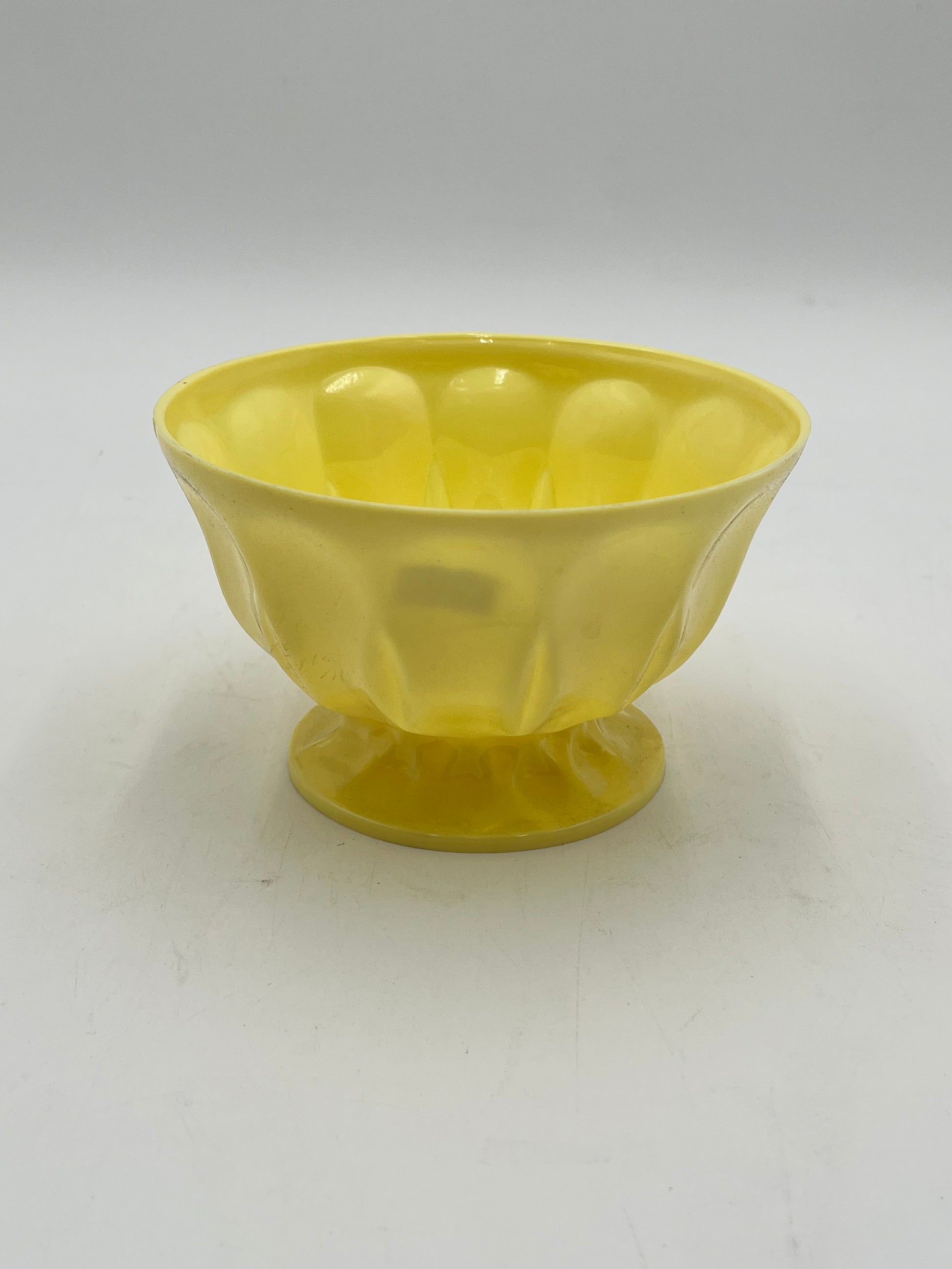 A pastel pedestal bowl in yellow. Perfect 4x6 floral base for décor or sympathy tributes. Available @ floralsuppliespoint1.com for $5.99