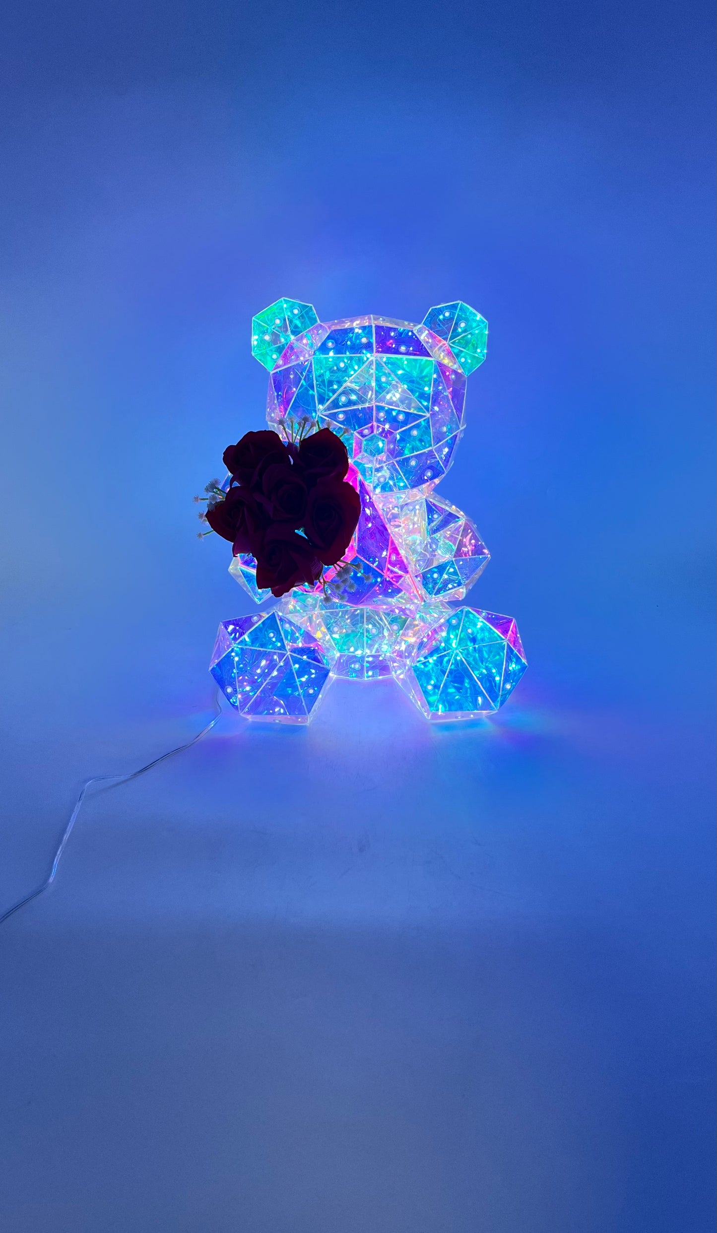 Iridescent light-up Rose Crystal Bear with red roses, USB cable, and pink gift box. Sold by floralsuppliespoint1.com for Individual  $34.99 retail or $160 wholesale for 8-count case.