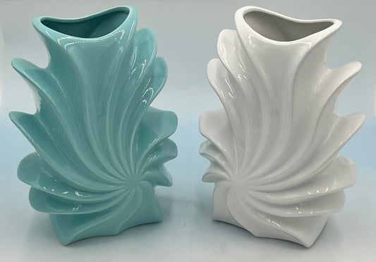 Shellflare ceramic vases in glossy aqua and white with sculptural ocean swirl design, 10" x 3.5", 2.10 lbs each, available at floralsuppliespoint1.com. Ideal for bold floral accents.