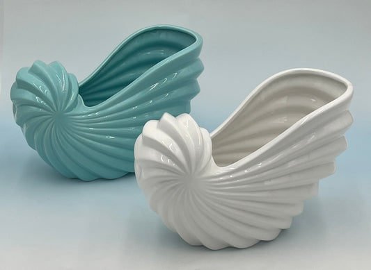 Shellglo ceramic vases in glossy white and aqua with spiral shell design, 6" x 6.5", 1.60 lbs each, sold by floralsuppliespoint1.com. Ideal for coastal floral decor and small arrangements.
