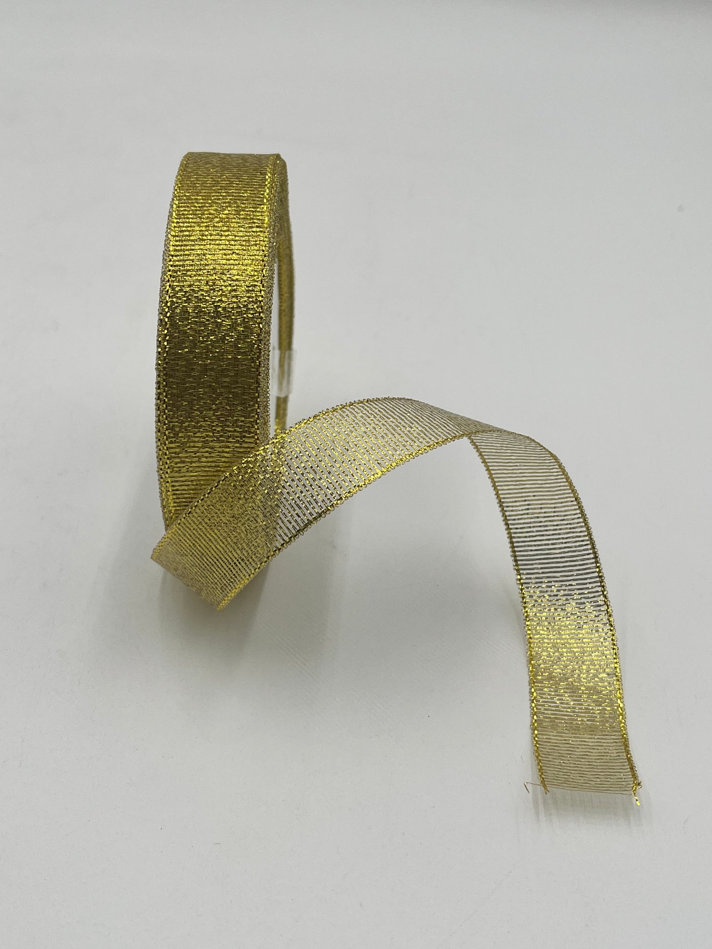 Gold polyester ribbon roll in 1” x 25 yards, ideal for floral design, gifts and crafts. Sold individually by floralsuppliespoint1.com.