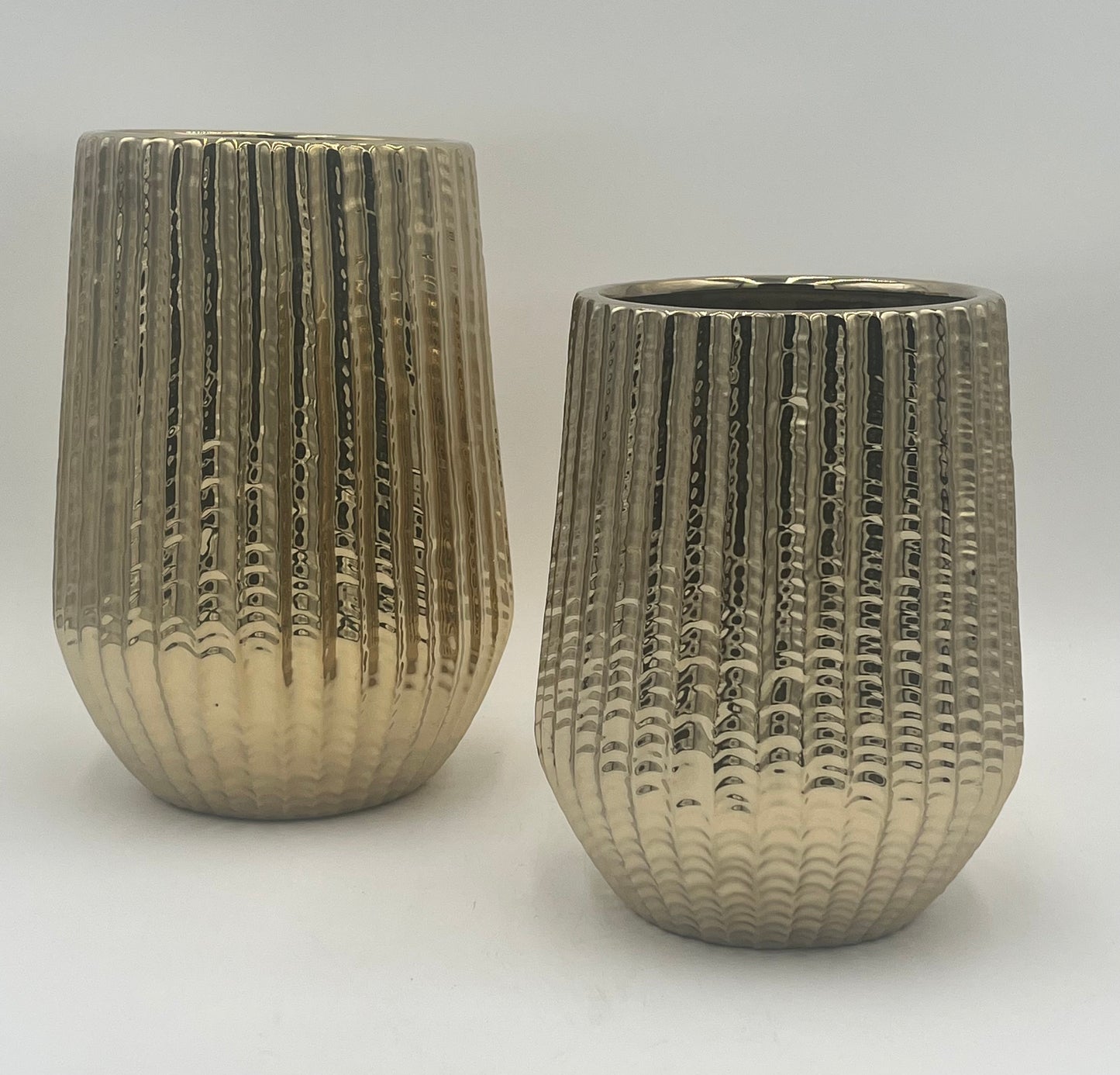 Solonique ceramic vases with gold metallic ribbed finish. Elegant modern décor for floral displays sold by floralsuppliespoint1.com.