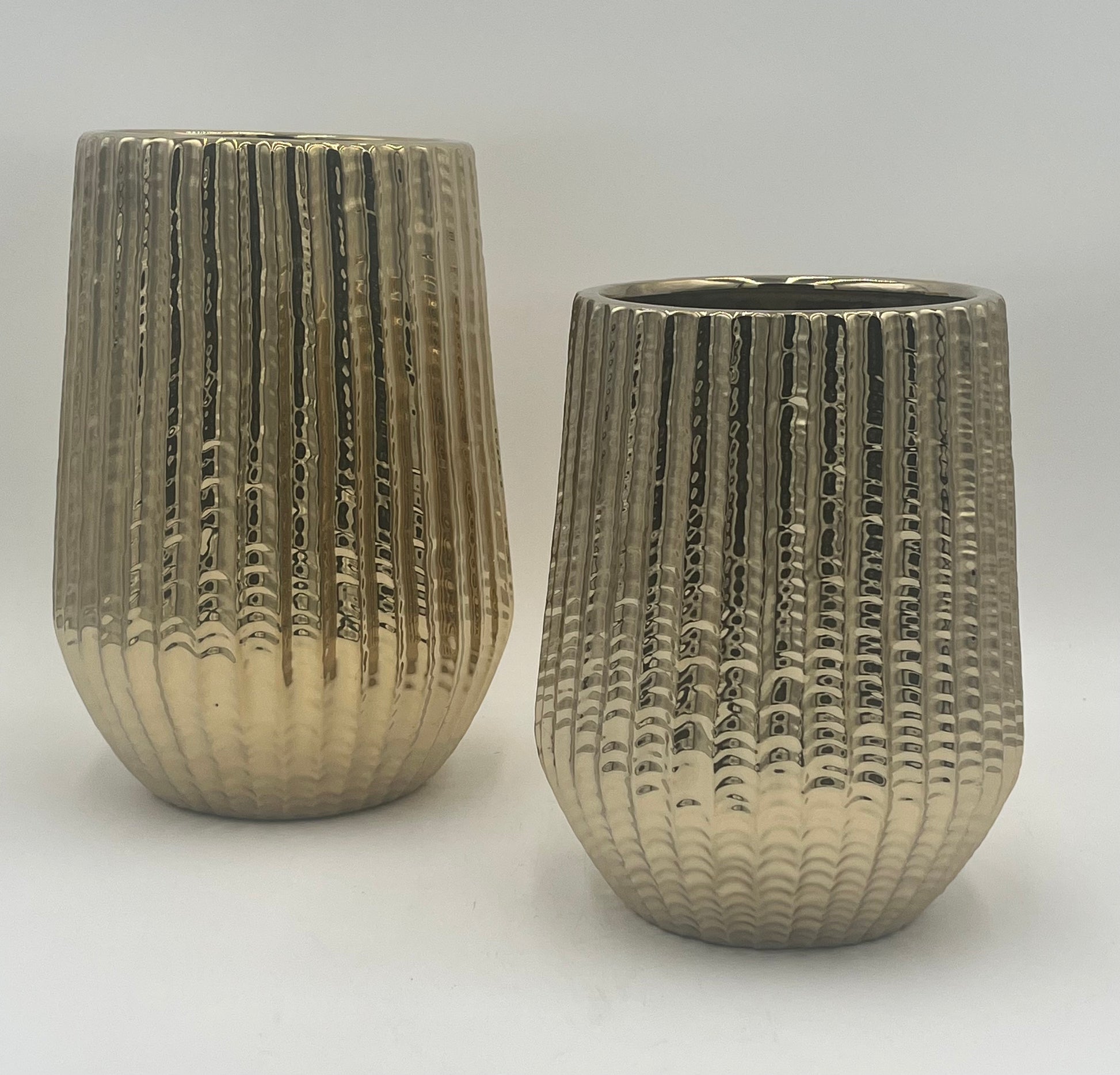 Solonique ceramic vases with gold metallic ribbed finish. Elegant modern décor for floral displays sold by floralsuppliespoint1.com.