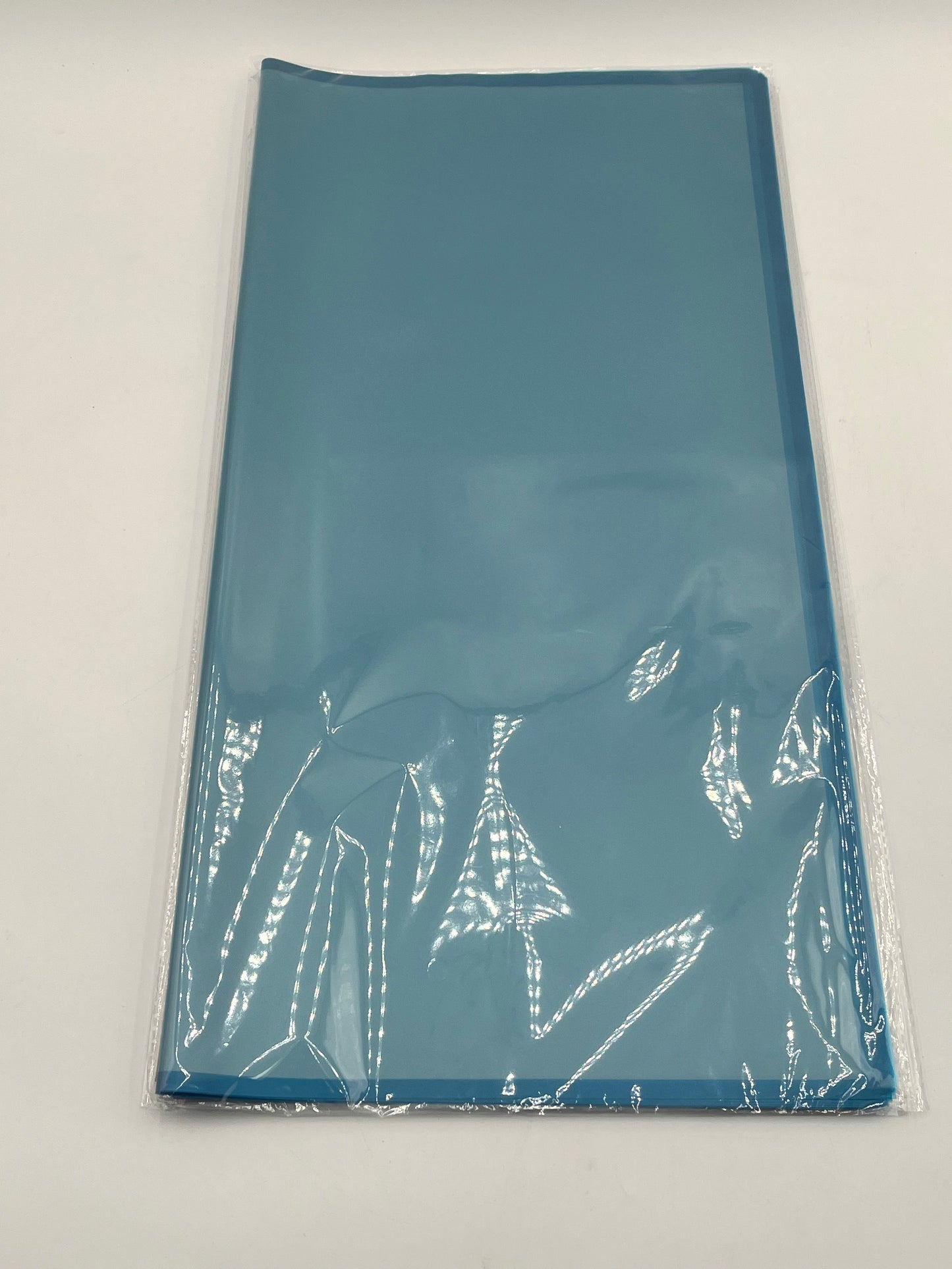 Translucent wrapping papers with 1/4" accent trim in blue color. 20-pack sheets elevate bouquets, gifts & baskets. Sold by floralsuppliespoint1.com for $9.99