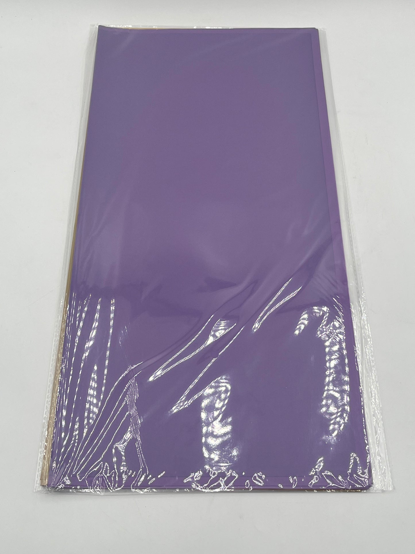 Translucent wrapping papers with 1/4" accent trim in purple color. 20-pack sheets elevate bouquets, gifts & baskets. Sold by floralsuppliespoint1.com for $9.99