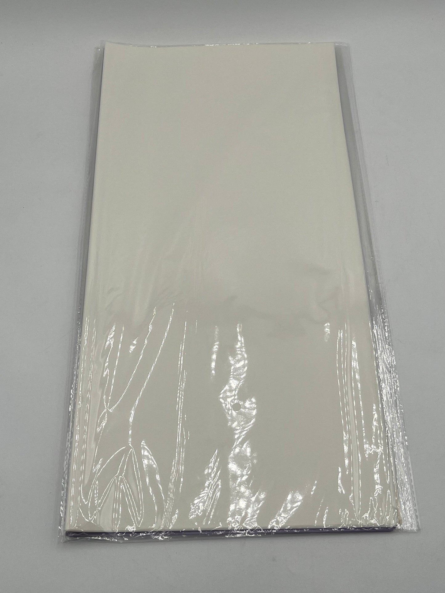 Translucent wrapping papers with 1/4" accent trim in white color. 20-pack sheets elevate bouquets, gifts & baskets. Sold by floralsuppliespoint1.com for $9.99