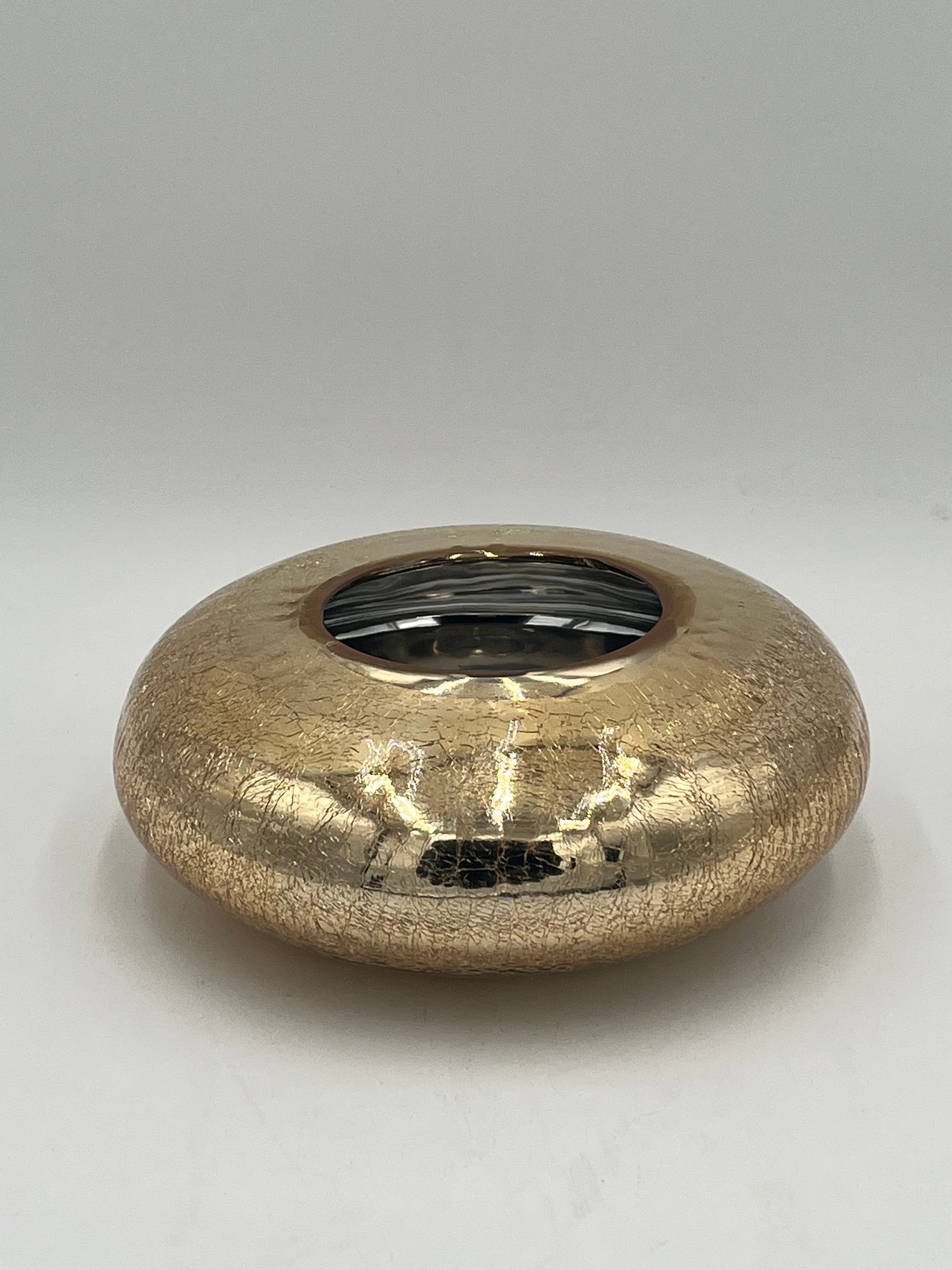 The Velantura 3.5x4 Op vase by Floral Supplies Point features a round, flat shape with a small central opening, cracked textured surface, and glossy gold finish—perfect as a stunning accent on any plain white background.