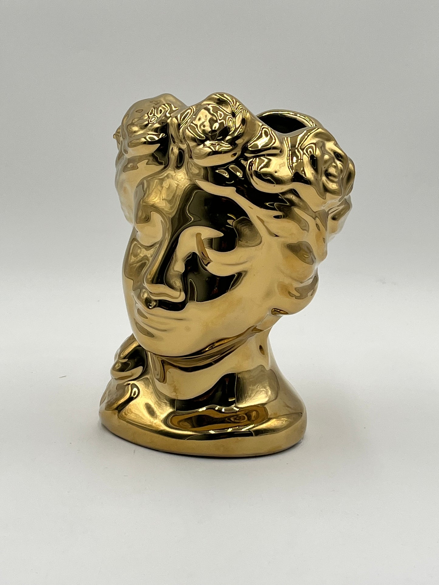 Venus Bloom ceramic vases in gold with floral crown design. Elegant statement décor for floral displays sold by floralsuppliespoint1.com.