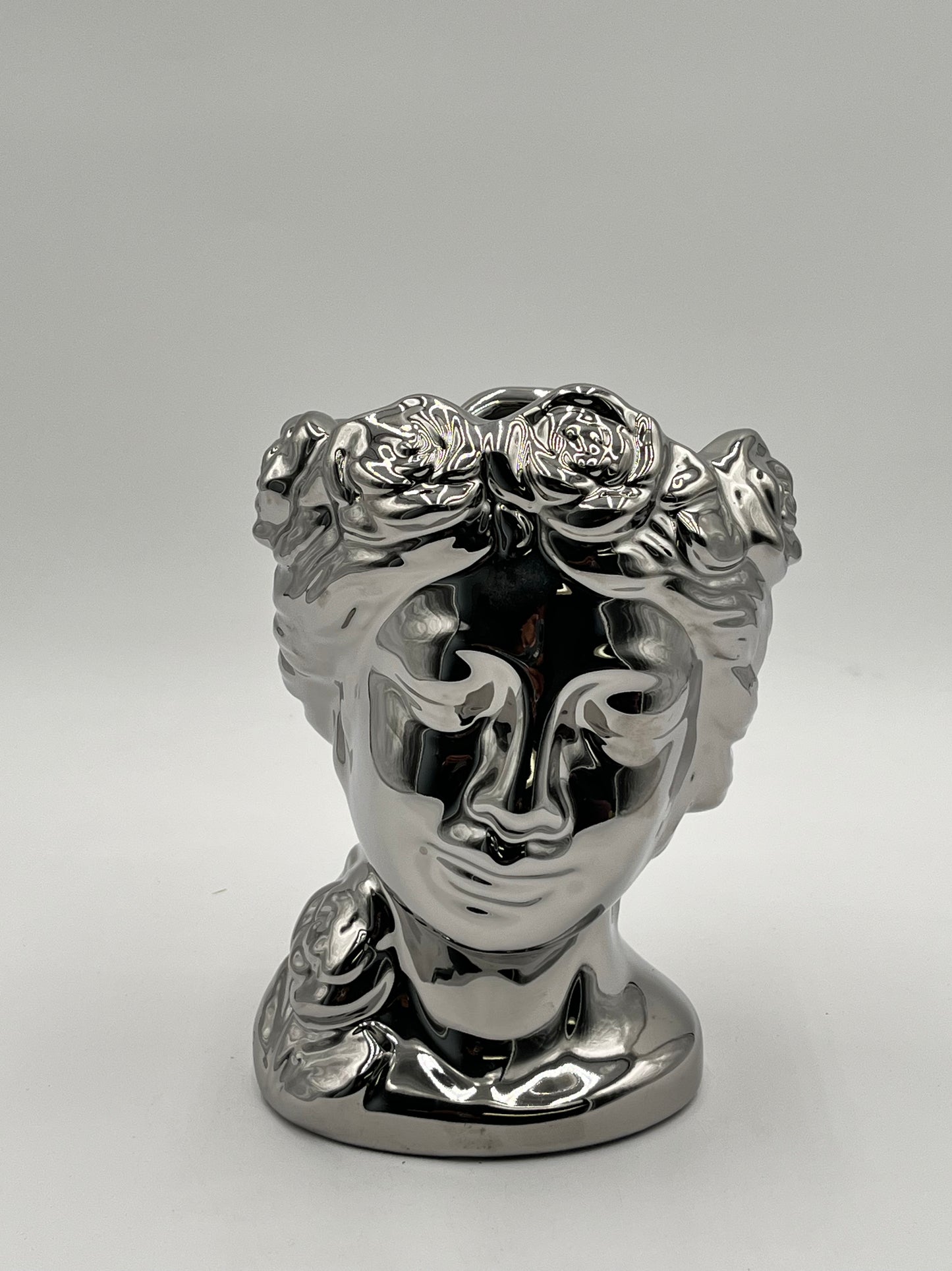Venus Bloom ceramic vases in silver  with floral crown design. Elegant statement décor for floral displays sold by floralsuppliespoint1.com.