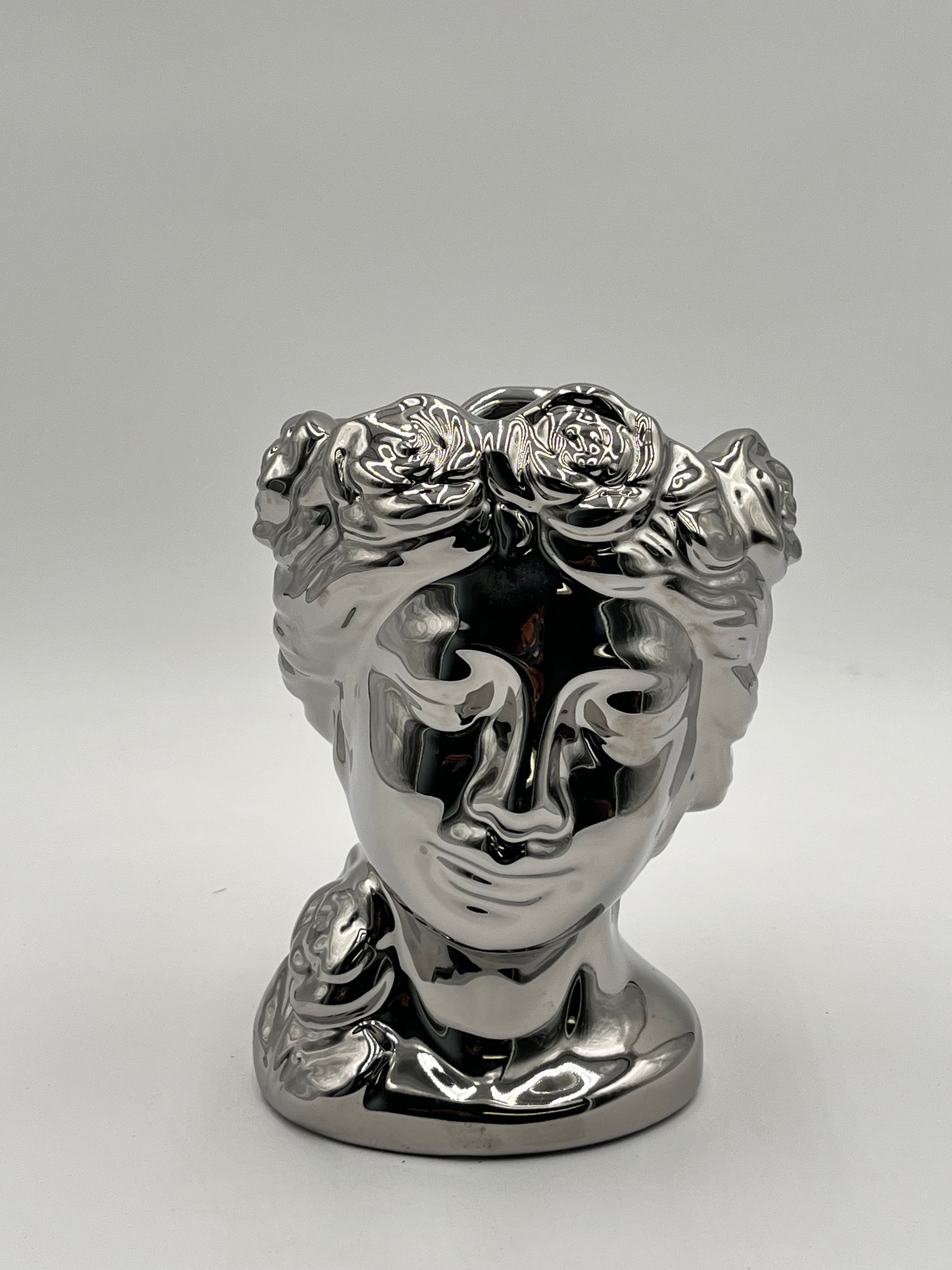 Venus Bloom ceramic vases in silver  with floral crown design. Elegant statement décor for floral displays sold by floralsuppliespoint1.com.