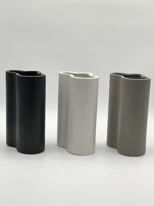 Waveline Core ceramic vases in Matte Black, White, and Grey with ribbed design, sold by floralsuppliespoint1.com. Each vase measures 9" x 5" and weighs 2.30 lbs, perfect for modern floral arrangements.