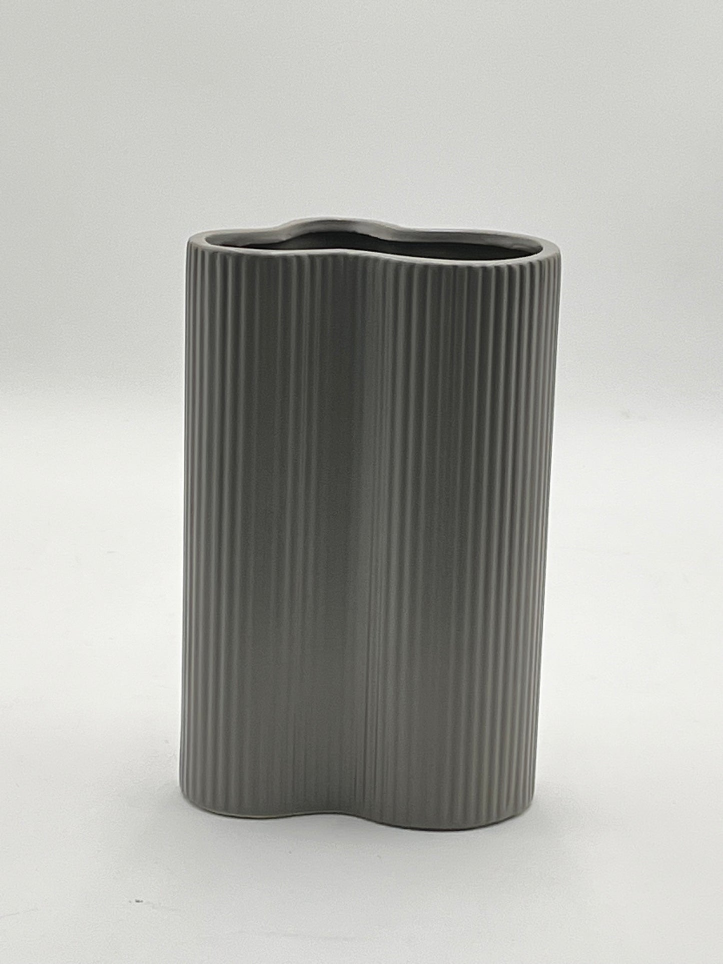 Waveline Core ceramic vase in Matte Grey with ribbed design, sold by floralsuppliespoint1.com. Each vase measures 9" x 5" and weighs 2.30 lbs, perfect for modern floral arrangements.
