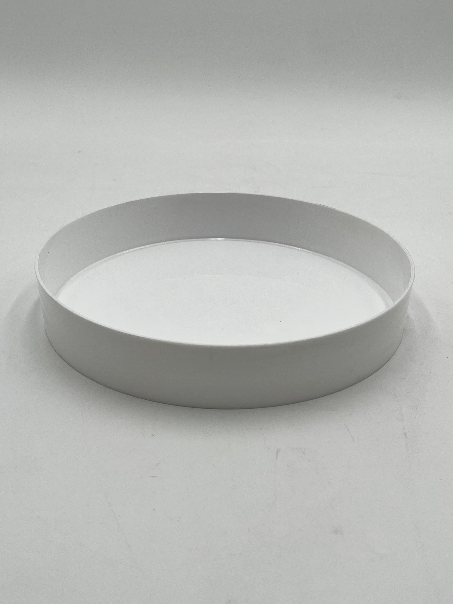 9” white round floral tray,1.5” deep. Perfect for foam-based fresh or artificial flowers. Durable, stylish and ideal for events. Sold by floralsuppliespoint1.com